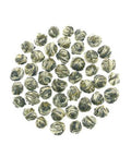 Hand rolled Jasmine Pearl Green Tea Loose Leaf on a white background, showcasing delicate jasmine infused pearls, 3 oz tin pack of 2