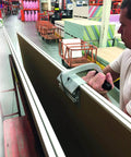 JawClaw Panel Gripper for Plywood, Drywall and Steel Sheets in use, showing secure handling and stable alignment in store setting.