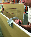 Person using JawClaw Panel Gripper for Plywood, Drywall and Steel Sheets designed for smooth motion and stable alignment in automation and mechanical systems