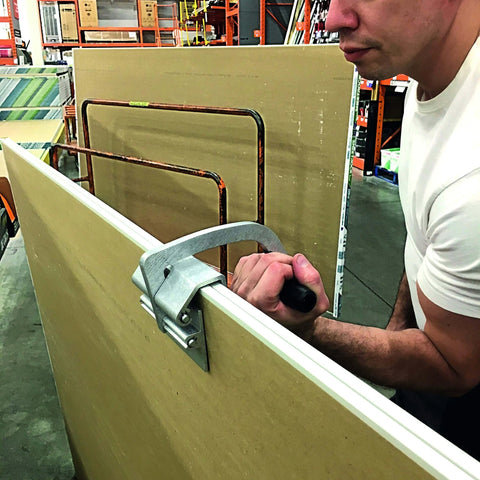 Person using JawClaw Panel Gripper for Plywood, Drywall and Steel Sheets designed for smooth motion and stable alignment in automation and mechanical systems