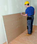 Worker using JawClaw Panel Gripper for Plywood, Drywall and Steel Sheets in automation and mechanical systems for stable alignment.