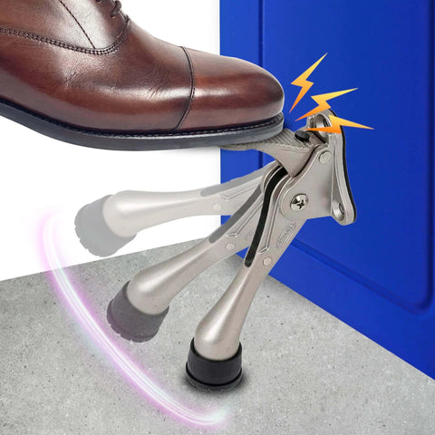 Foot activating One Touch Kickdown Door Stopper, satin nickel finish with height-adjustable rubber tips by HASHI, keeping door open.