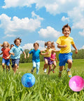 Children playing with 2PCS Inflatable Playground Balls, 8.7 Inch Marbleized Bouncy Balls Rubber Kickballs in a grassy field