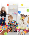 Children playing with 12 pieces soft foam balls lightweight mini play balls for safe indoor toys fun vibrant assorted colors orbs.
