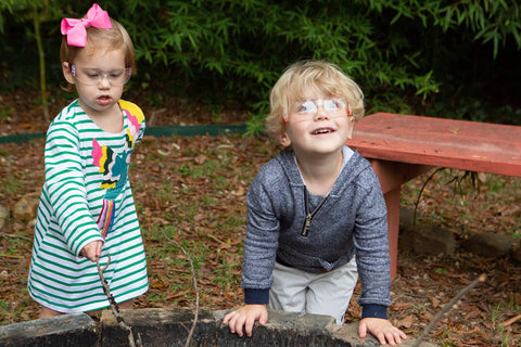 Children wearing Kids Safety Glasses ANSI Z87.1 EN166 Certified Impact Resistant Clear Lenses playing outdoors