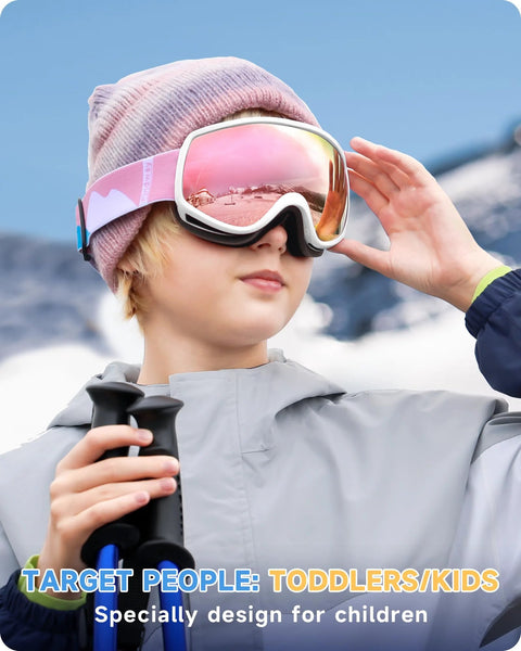 Child wearing Kids Ski Goggles For Boys And Girls 3 To 12 With Anti Fog UV400 Protection, pink frame, snowy background.