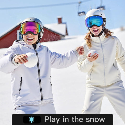 Children wearing kids ski goggles for boys and girls ages 5 to 14, safe TPU frame, anti fog lenses, playing in the snow.