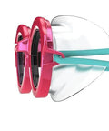 Side view of Sunny G Kids Swim Goggles with Anti Fog Lenses for Ages 3 to 8 UV Protection featuring pink frame and blue strap.