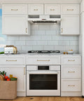 White kitchen with Antique Brass Cabinet Pulls 3 Inch Center 10 Pack Zinc Alloy Handles on drawers and cupboards, featuring a smooth finish.