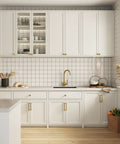 Modern kitchen with Champagne Bronze Cabinet Pulls 10 Pack 5 1 16 Inch Solid Zinc Alloy on white cabinets and drawers.