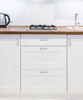 20 Pack 3 Inch Hole Center Solid Kitchen Cabinet Handles in Polished Chrome on white cupboard doors and drawers