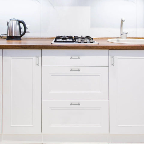 20 Pack 3 Inch Hole Center Solid Kitchen Cabinet Handles in Polished Chrome on white cupboard doors and drawers