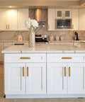Modern kitchen with white cabinets featuring the Two Pack Antique Brass Cabinet Pulls With Backplates And Spacers 5 Inch Center To Center Drawer Handles.