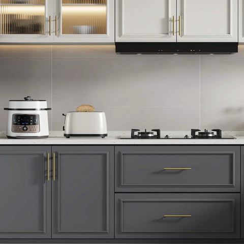 Kitchen cabinet with Solid Iron Cabinet Pulls 3 Inch Matte Gold Handles, shown installed on cupboard and drawers, modern kitchen setting.