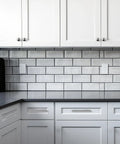 Close-up of kitchen showing 30 Piece Stainless Steel Cabinet Pulls And Knobs Set In Silver Matte Finish Includes 15 Cabinet Pulls And 15 Round Knobs