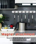 Magnetic utensil holder with hooks attached to kitchen wall above stove.