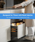 Foot Pull For Trash Cabinet Drawer Hands Free Design For Kitchen Garbage Cabinet installed in white kitchen with person using foot