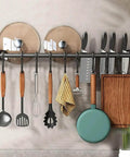Modern Kitchen Utensil Rack, Black Wall-Mounted Hanging Rod with 6 Movable Hooks, 15.75 Inch Metal Storage Organizer in use