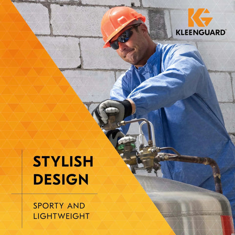 Worker wearing V30 Nemesis Safety Glasses With Mirror Coating Smoke Lenses Black Frame Unisex in industrial setting.