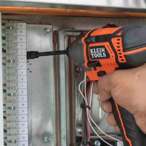 Person using 3-In-1 Flip Impact Socket Set for Quick Drive Size Swaps, No-Fuss 1/4 and 5/16 Hex Nut Drivers by Klein Tools.