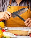 Person sharpening a knife with a Flat 6 Inch Hand File With Double Cut Teeth And Single Cut Edge Made From High Carbon Steel