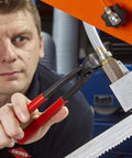 Person using Knipex Tools Eight Point Seven Five Inch Ear Clamp Pliers 1 Ear 2 Ear Clamp Tool 1098i220 on metal fitting