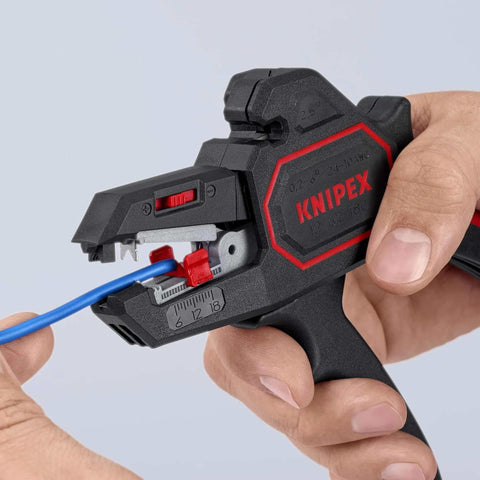 Person using Knipex Automatic Wire Stripper 10-24 AWG, 7.25 Inch Length for precision insulation stripping on blue wire.
