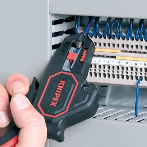 Knipex Automatic Wire Stripper 10-24 AWG, 7.25 Inch Length, ergonomic tool in use for electrical wire stripping at a circuit panel