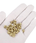Knurled Insert Nuts, 100pcs M3 x 7mm L x 5mm OD 3D Printing Brass Nuts Female Threaded Inserts Brass Heat Set Insert Embedment Nuts on a glove