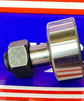 Side view of KR32 32mm Cam Follower Needle Roller Bearing on blue background