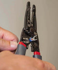 Hands using Kurve Wire Stripper Crimper Cutter Multi Tool for 10-26 AWG solid and 12-28 AWG stranded wire, reinforced head visible