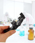 Person holding a 2 Pack Boss Head Clamps for Right Angle Lab Stands in a laboratory setting