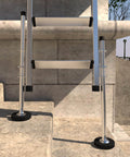 Ladder Levelers For Type II I And IA Extension Ladders Up To 32 Feet With Anti Slip Threaded Adjustable Legs, installed on stairs