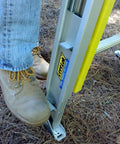 Close-up of Permanent Mount Ladder Levelers For Uneven Surfaces 2 Legs Complete Kit By Levelok in use, fits aluminum ladder.