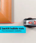 Effortlessly align pictures, shelves, and mirrors with this self-leveling 360-degree laser level and wall mount in use on wall.