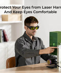 Person wearing Lightweight 50g Laser Safety Glasses For F1 F1 Ultra S1 M1 D1 Pro And D1 Lasers while working with laser equipment