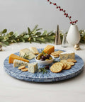 12.6 inch mother of pearl lazy susan turntable with blue starburst design, decorative rotating tray with cheese and crackers.