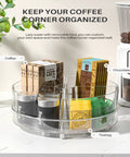 Clear 2 Pack 9 Inch Lazy Susan Organizer With 4 Removable Bins, holding coffee, chocolate, and tea bags on a countertop.