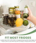 Hand accessing condiments on a rotating refrigerator lazy Susan organizer, square, 16.5 x 11 inches, clear PET, with 360 degree spin.