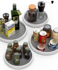 Four Pack Lazy Susan Spice Organizer Rotating Tray Set with jars and bottles, showing two 10 inch and two 12 inch trays in use.