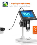 Microscope, LCD Digital Coin Microscope 1000x with rechargeable battery, showing 1800mAh capacity, charging via wall socket, 4.3-inch screen.