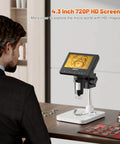 Man using Microscope, LCD Digital Coin Microscope 1000x with 4.3-inch display viewing coin details, 8 adjustable LED lights.