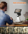 Person using Microscope, LCD Digital Coin Microscope 1000x with 8 adjustable LED lights in a room, PC view compatible with Windows/MacBook, EDM4, 4.3-Inch.