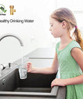 Girl filling glass at kitchen sink with Lead Free Brass Three Eighth Inch Angle Stop Add A Tee Compression Tee Valve With Three Eighth Inch Inlet And Outlet Connections Two Pack For Residential And Commercial Potable Water Applications visible.