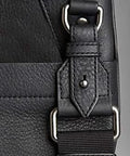 Black leather bag with strap using Solid Brass Ball Head Screw Back Studs 6.5 mm Silver Plated Nipple Rivets Set Of 10 for leathercraft projects.