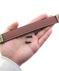 Hand holding Leather Drawer Handles Set Two Pieces 7.5 Inch Brown Luggage And Suitcase Pull Handles With Installation Screws