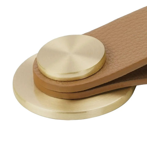 Close-up of brass brown Leather Drawer Pulls Set Of 6 in faux leather with zinc alloy button, for kitchen and bathroom cabinets.