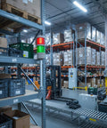 Two Stack LED Andon Tower Signal Light For Industrial Workstations with red and green indicators in a warehouse setting.