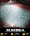 Aerial view of a brightly lit basketball court at night highlighting the illumination from two LED floodlights on the court edges.