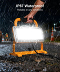 Bright 6500LM LED Work Light With Stand, 500W Equivalent Flood Light, IP67 Waterproof used in rainy jobsite condition